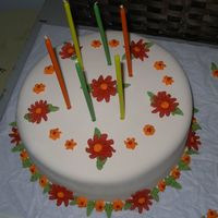My Mother's 60Th Birthday Cake A fondant covered flower cake. Fall themed!Inside: Lemon cake with lemon pie filling.Very successfull and very good