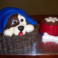 100_0197.jpg Made for a 1st birthday. Dog made with various shapes of cake. The doggie bowl is a real dog bowl with cake inside for the birthday boy to...