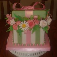 Birthday Flower Present Inspired by ILoveMy6Boys. 6" chocolate square cake with chocolate gaunche. Gumpaste flowers and leaves. Thank you for looking.