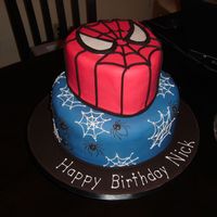Spiderman Inspired by the many cake here on cc. The top tier I shaped a little bit for his head. Web and spiders (really do not like spiders) are all...