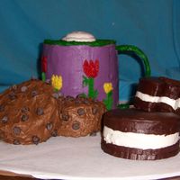 Fannie's Cookies And Cocoa This was a short-notice cake for my sister. I usually like to have a couple of weeks to plan a cake thoroughly. This one I did very little...