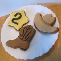 Cowboy Cookies gingerbread cookie cutouts decorated with MMF. These were so fun to make, and i love how clean they look ( my royal icing skills still...