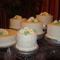 Calla Lily Wedding Cakes 3 layers of cake each with either strawberry filling, pineapple filling or Bavarian cream covered in crusted butter cream. After drying I...