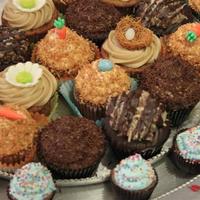 Assorted Easter Cupcakes Tropical Carrot, German Chocolate, and Banana Cupcakes all decorated for Easter.