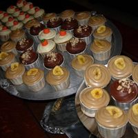 Three Cupcakes Banana with Penuche, Pumpkin with White Chocolate Cream Cheese, and Chocolate Hazelnut.