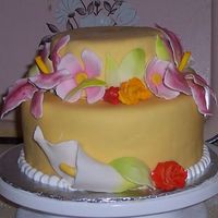 100_3433_1.jpg all hand made sugarpaste flowers (not even a cutter used) on a vanilla cake with lemon buttercream icing and white modeling chocolate.