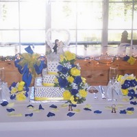 Blue & Yellow Wedding Cake Red velvet cake with buttercream icing and cream cheese filling. Flowers were silk that the bride brought me.