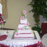 Misty's Wedding Cake All white cake with buttercream icing. Top tier bc filling, 2nd lemon filling, 3rd strawberry filling, and bottom tier pineapple filling....