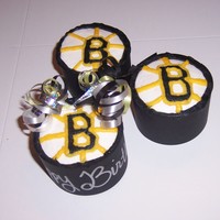 Boston Bruins Cupcakes Birthday cupcakes for a huge Boston Bruins hockey fan. tried to make them look like hockey pucks with the Bruins logo on top. TFL