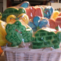 Cookie Favors I made two baskets of cookies on a stick based on the decor of a nursery for a baby shower. Also attached to each ribbon on the stick was a...