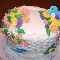 Wilton Course 2 Cake Wilton Course 2, Buttercream with royal icing flowers and colorflow bluebirds.