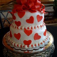 Anniversary Cake This was my anniversary cake. Amaretto cake with pistachio filling. B/C frosting with amaretto. Fondant hearts & bow.