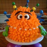 Monster! Monsters are fun! This was for a 5-year-olds b-day. New craze: photos from Oriental Trading for inspiration. Cake body was 2 9" layers...