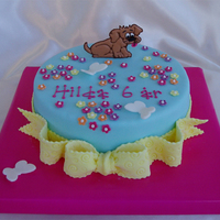 Dog And Flowers Dog, flowers and bow for a girl's 6th birthday. Dog is RIT (Royal Icing Transfer) and all the rest is MMF.