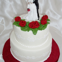 Red Roses And Stenciling Small wedding cake with white RI stenciling on the side and red RI roses on top. Topper provided by the bride.