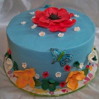 Random Flowers This was a donation. Dark chocolate cake, ganache filling, covered in buttercream. Random gumpaste flowers.