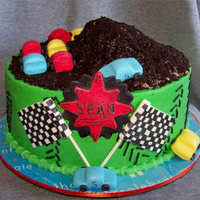 Monster Truck Cake Customer added a monster truck to the top. Dark choclate cake, cookies n cream filling, covered in buttercream and mmf or gumpaste decor....