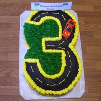 Hot Wheels Cake This cake is for my son's 3rd birthday. It was Hot Wheels theme. The cake is checkered pattern chocolate & yellow cake. He...