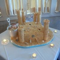 Sandcastle Wedding Cake A wedding cake for my brother in Saint Augustine FL. Yellow Amaretto Cake, Raspberry Cream Filling with BC icing. Sand is 3 boxes of Nilla...