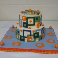 Retro Geometric Design Baby Shower Cake Cake is for a baby shower. Heat and humidity was an issue. Buttercream with fondant geometric shapes & gumball decorations, Darn Good...