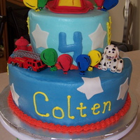 Firetruck White cake n bottom, chocolate on top. Vanilla BC hydrant, hat, balloon, stars and dog are fondant.