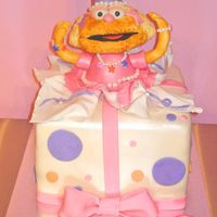 Zoe Did this one in collaboration with my husband. Zoe's head is a rice krispie treat covered in fondant. Her body is a cake (mini...