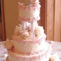 Buttercream Petals This is a buttercream, edible pearls, and the borders are buttercream petals in pink.