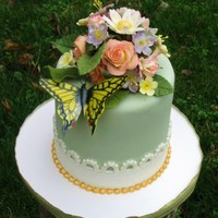 Springtime Wonders Handmade gumpaste roses, daisies, carnations and blossoms. Butterfly is hand colored.