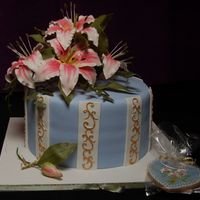 Mother's Day Cake W/ Day Lilies Lilies made of gumpaste. Cookie matches cake. TFL!