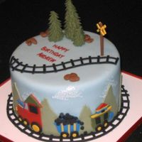 Boy's Birthday Train Cake Fondant covered cake with fondant/gumpaste decorations