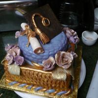 Congratulations! This cake was designed for students graduating from Bible College. All decorations were made from gumpaste and painted with edible shimmer...