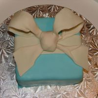 Sarah's Cake Here is my second attempt at fondant. I made this for my goddaughter. I am really unhappy with the bow. I hope they will get easier each...
