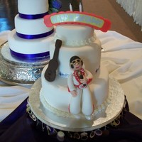 Groom's Cake/"e" Style Carrot cake covered in fondant with 3D Elvis and guitar. Groom's birthday was on the wedding day-he loves to sing Elvis Karaoke