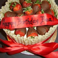Chocolate Covered Strawberries With Piroutte Wafers Birthday cake for a 58 year old. They wanted something elegant, the second one of these I have made. 8" Vanilla with BC icing (cake...