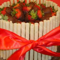 Pirouette Cake With Chocolate Covered Strawberries Quick cake for a Lobster Boil. 8" WASC - Chocolate Cake, fresh strawberries in buttercream filling, chocolate fudge frosting....