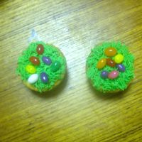 Grass With Jelly Bean Had some extra time so I made these. Much faster than the basket weave I did earlier. Yellow cupcake butter cream icing and jelly beans.