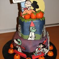 Great Pumpkin Charlie Brown! Fondant covered chocolate ganache cake. Characters done with choclate transfers. Marzipan pumpkins and leaves. Thanks to alleypoo9782 for...