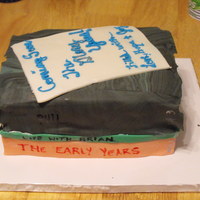 Divorce Cake Top book is battered as it was an abusive marriage. We wanted to basically represent an new part of her life. Didn't like the broken...