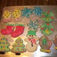 Christmas Cookies sugar cookies decorated with colored sugar and thinned out cookie dough before baking. No icing was used on these.