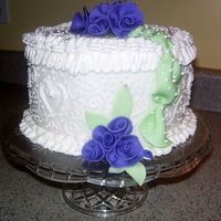 First Mothers Day Cake - Second Cake Ever Bottom layer of fondant w/ fondant flowers. Scrollwork, dots, and flowers are buttercream.