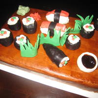 Sushi Anyone? i used rkt inside my sushi rolls. the rest is fondant. the soy sauce is tinted piping gel.