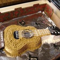 Guitar Cake This is one of my first cakes. My nephew loved it so that's what was important. The notes are MMF and the plaque is chocolate. TFL!