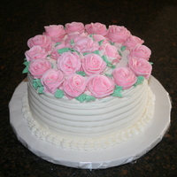 Grandma's Birthday Cakes WASC with buttercream, decorated with buttercream roses.Dark Chocolate cake with raspberry filling and chocolate buttercream.Made both...