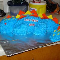 Dinosaur Birthday Cake I made this last year for my son's 3rd birthday. The head is supposed to be standing up but it kept falling down, I tried everything...