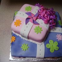 Girls Flowery Cake This is my first time using fondant to cover a cake. Actually it's my first time ever making a cake like this. I had a good time...