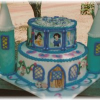 Princess Castle Birthday Cake covered in buttercream...decorations in fondant and princess pictures were laminated...really enjoy doing these!