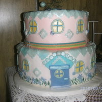 Springtime 'who House' This started out as a castle...but took another direction. This is a dummie...just for fun.Fondant and gumpaste, pearl dust accents.