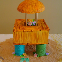 Tiki Hut Knock-off of a tike hut shown on Ace of Cakes.....Cake stand base was 1/4" plywood with 1 inch dowel rods screwed into base. PVC pipe...