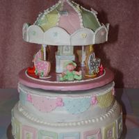 Img_1544.jpg This cake was for a baby shower and the second layer has a motor that make the top spin around.