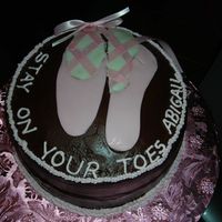 Ballerina Cake Double chocolate cake with fondant ballerina shoesand I used real ribbons.Abby really enjoyed her cake for her recital.